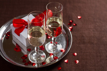 Champagne glasses, gift and  hearts