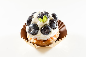 Blueberry tart on white background