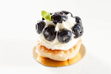 Blueberry tart on white background