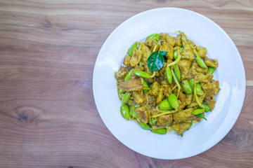 pork with curry paste on wood table
