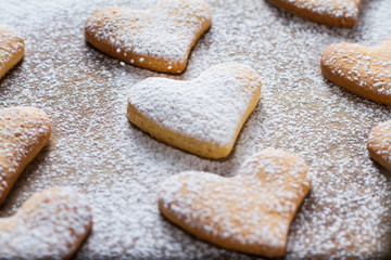 Heart shaped cookies on wood background