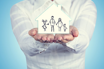 Proprety insurance concept ,Woman holding hands with a drawn family symbol.Family life insurance, family services, family policy concept.