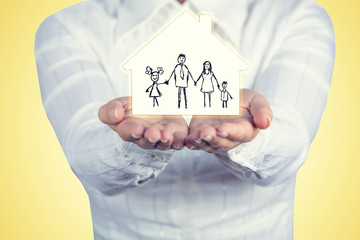 Proprety insurance concept ,Woman holding hands with a drawn family symbol.Family life insurance, family services, family policy concept.