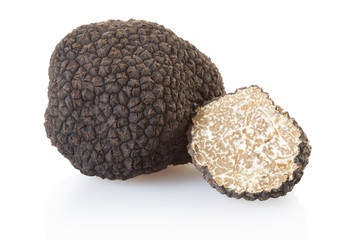 Black truffle and half isolated on white, clipping path included - obrazy, fototapety, plakaty