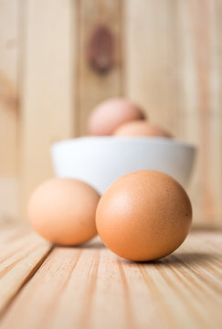 egg in bowl with wood background
