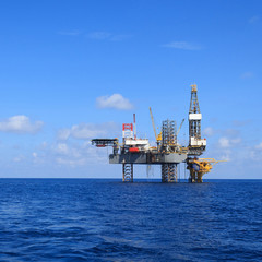 Offshore Jack Up Drilling Rig Over The Production Platform