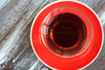 a glass of black tea