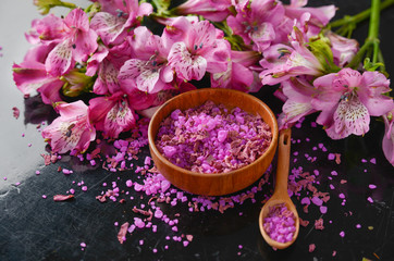 Obraz na płótnie Canvas Spa concept-pink orchid with petals in bowl,spoon