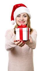 Young blond girl as santa`s hat with gift box.