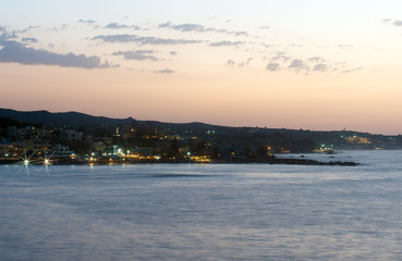 Fototapeta premium Night view of coastline with houses.