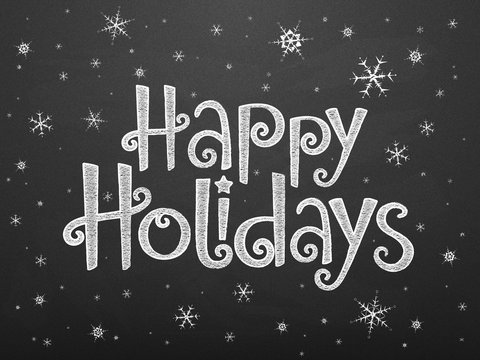 HAPPY HOLIDAYS in festive handdrawn font with falling snow on chalkboard