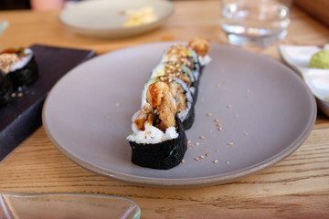 A row of sushi on a plate