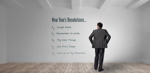 Obraz premium Composite image of businessman with hands on hips