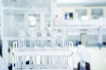 Laboratory equipment, glass tubes in laboratory interior.