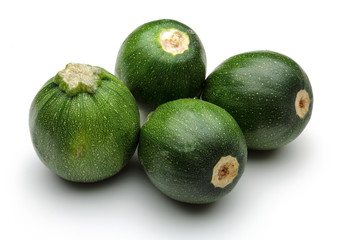 Fresh zucchini and sliced zucchini
