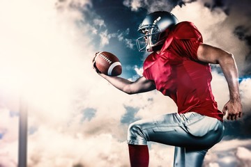 Composite image of side view of american football player running - Powered by Adobe