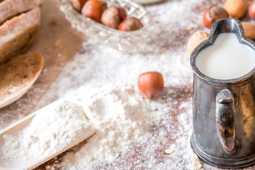 at the bakery, still life with mini Croissants, bread, milk, nuts and flour 