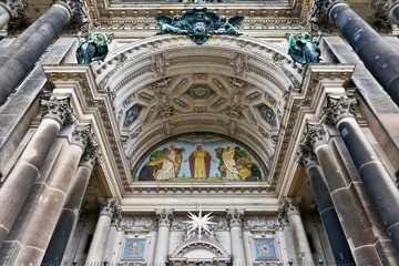Entry to cathedral in Berlin decorated by complex reliefs