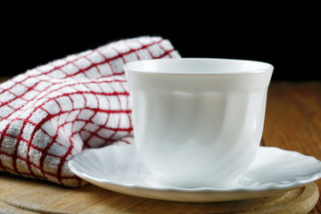 White coffee cup and towel closeup