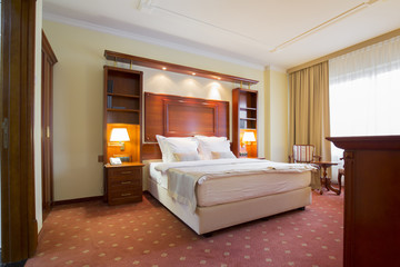 Fototapeta premium Elegant hotel bedroom interior