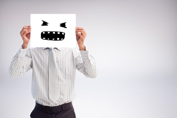 Composite image of businessman holding a white  sign