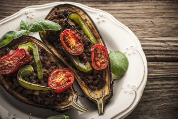 Stuffed eggplants  with vegetables on the wooden table