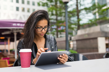 Young mixed race businesswoman portrait outdoors in Canary Wharf in London.