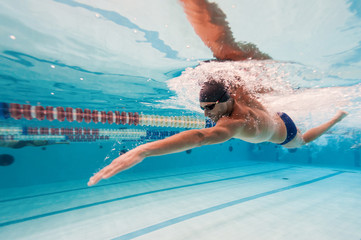 Professional man swimmer inside swimming pool. - 97791790