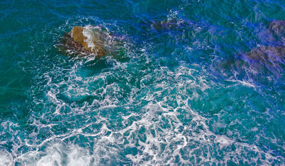 Fototapeta na wymiar sea waves, foam, top view