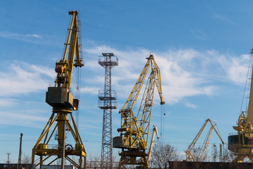 Fototapeta na wymiar Cranes at the port on the Danube town of Lom, Bulgaria
