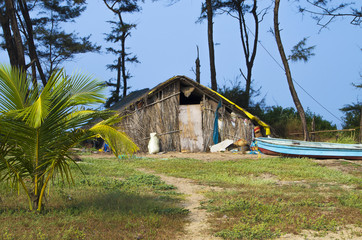 hut landscape on the seashore from palm leaves