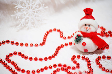 Christmas composition with snowman and red beads