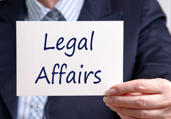 Legal Affairs or Legal Department - Manager holding sign with text