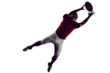 American football player trying to catch football © vectorfusionart