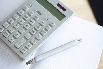 calculator pencil and notebook