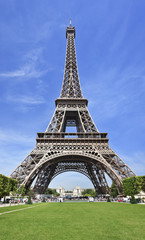 The majestic Eiffel tower in Paris against a blue sky, France.