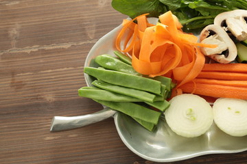 tray with fresh cut vegetables to cook
