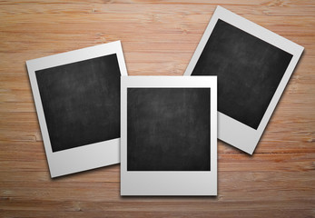 Three empty polaroids photo frames