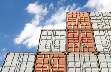 Colorful stack of container shipping at dockyard .