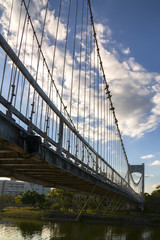 Fototapeta premium Suspension Bridge and Clouds