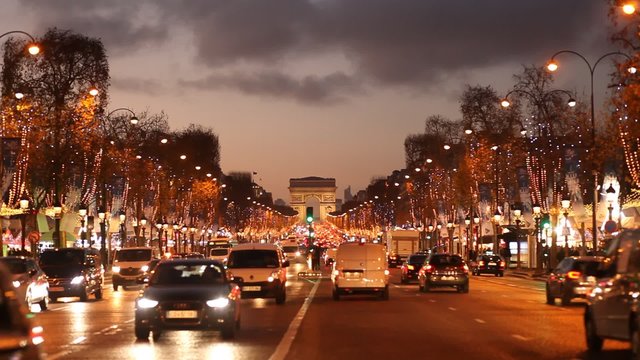 evening in Paris, traffic near Arc de triumph, christmas illumination