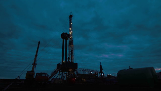 Timelapse oil drilling rig night