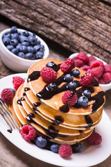 Pancakes with blueberries chocolate & raspberry