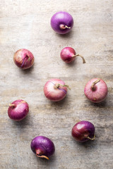 Shallot onions in a group on wood,still life