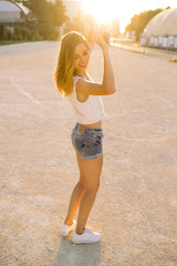 Hipster woman having fun, listening music and dancing