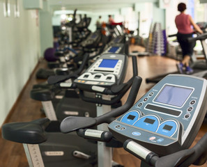 Trainer treadmill on the background of people