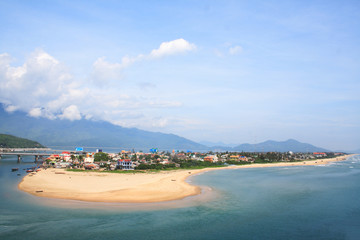 Lang Co beach, Hue province, Viet Nam. Lang Co is an attractive island-like stretch of palm-shaded white sand, with a turquoise lagoon on one side and 10km of beachfront on the other.