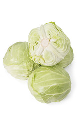 Pile of fresh young ripe green cabbage isolated on white background