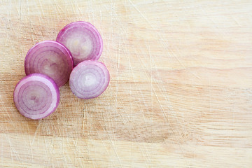 Sliced onions on a wooden floor