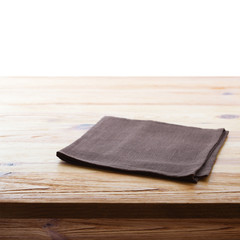 Tablecloth on wooden deck table, white background.